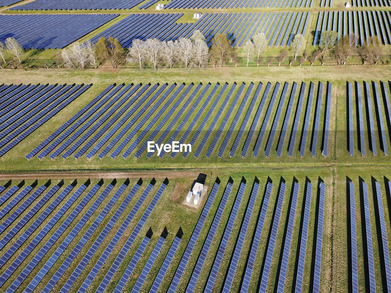 Drone aerial view power station producing clean, sustainable solar energy in italy