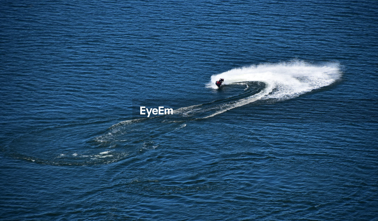 High angle view of person jet boating on sea