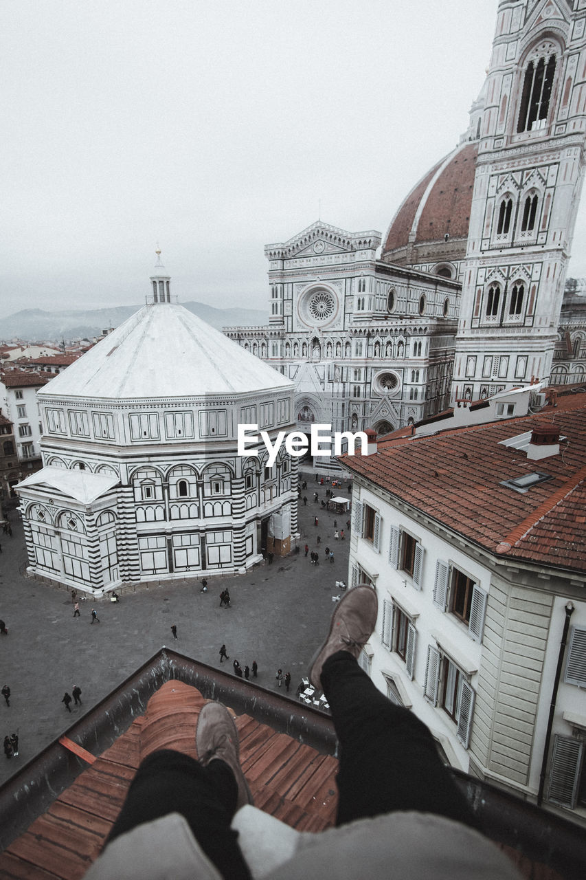 Low section of man on terrace against florence cathedral