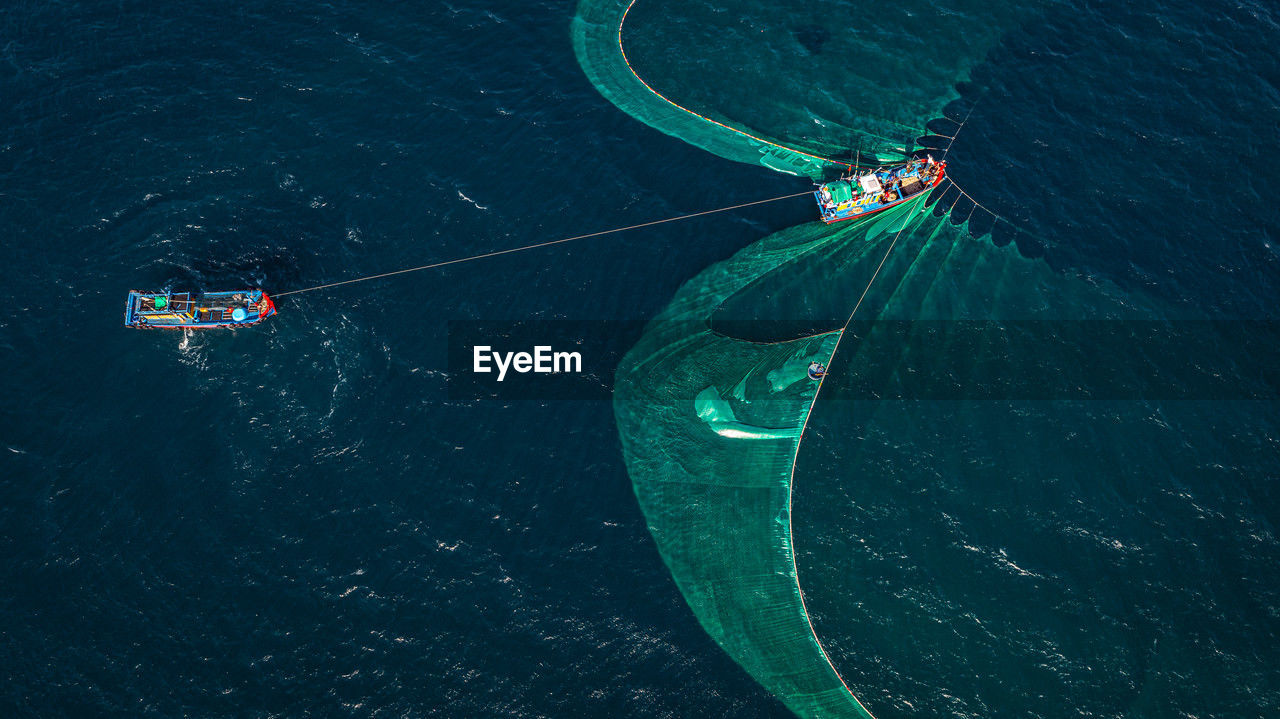 high angle view of man swimming in sea