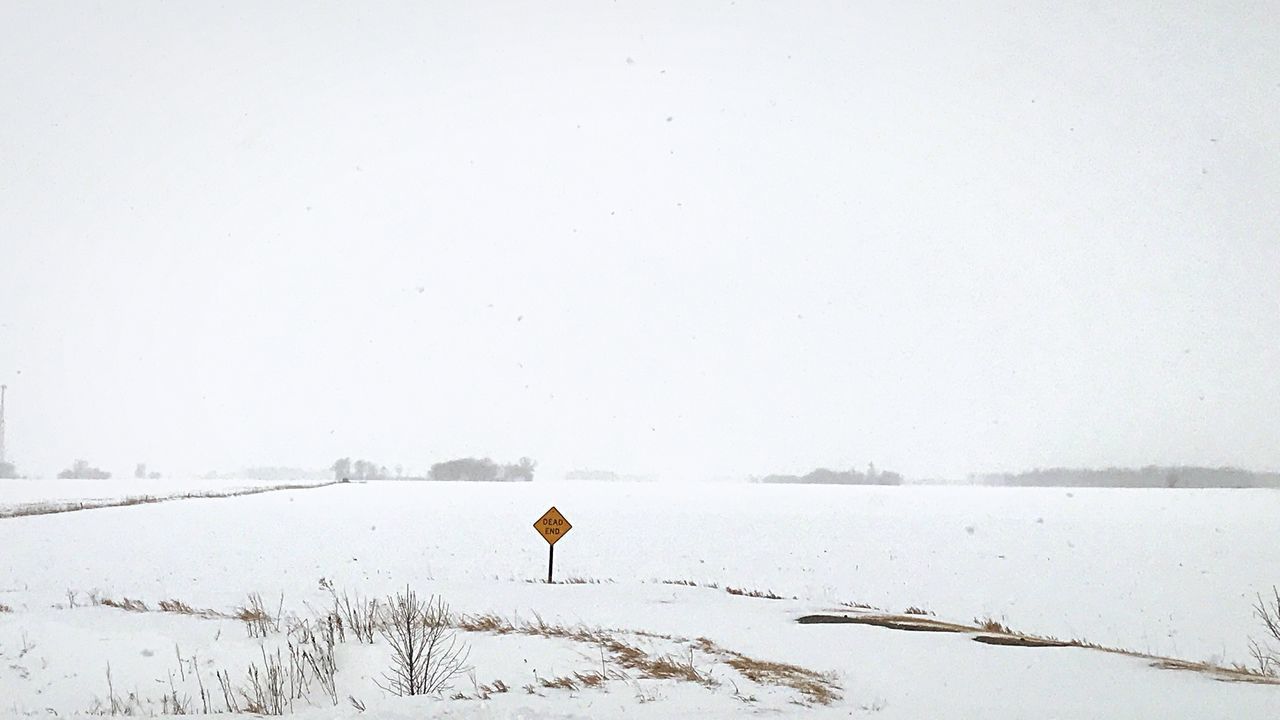 VIEW OF SNOW COVERED LANDSCAPE