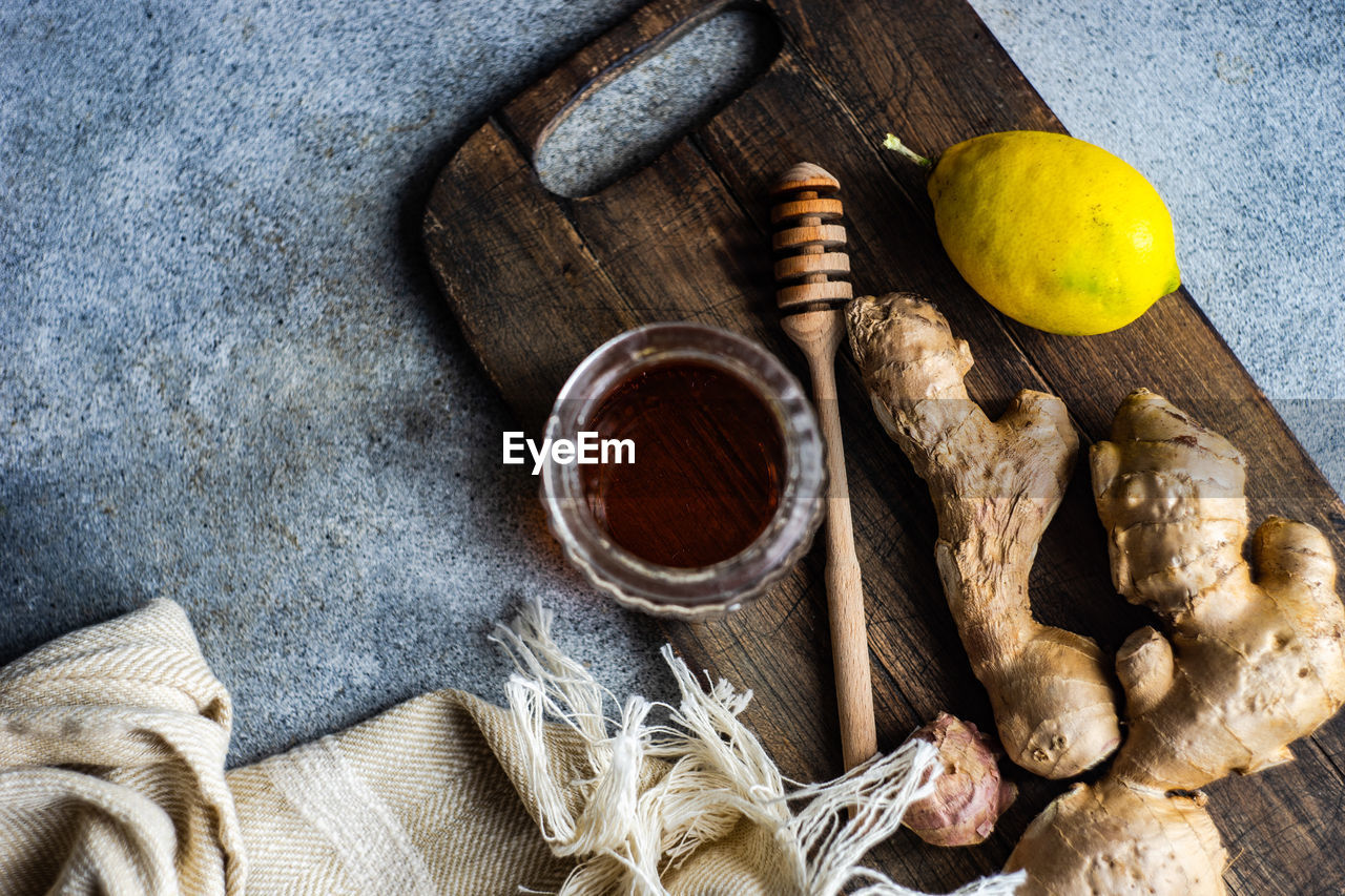 Ingredients for healthy tea with fresh lemon, ginger root and honey