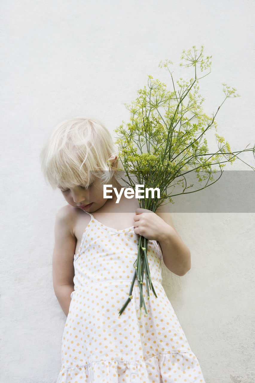 Girl holding fennel bouquet