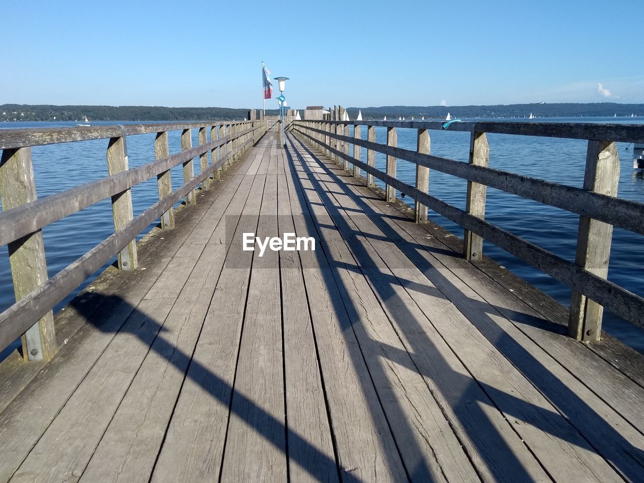 WOODEN PIER OVER SEA AGAINST SKY