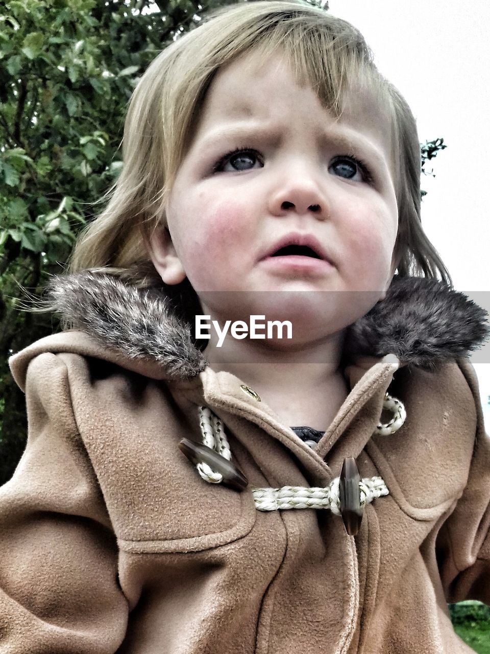 CLOSE-UP PORTRAIT OF CUTE GIRL IN MOUTH