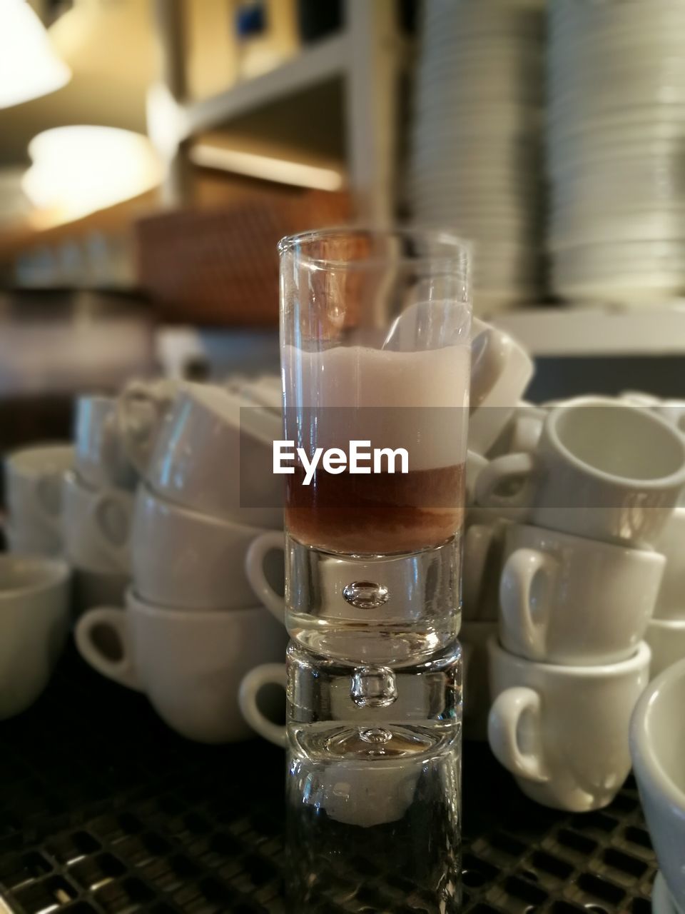 Close-up of coffee in glass on table