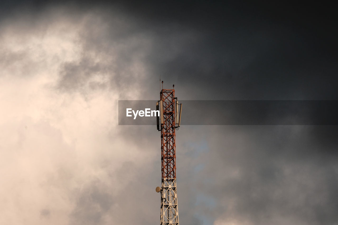 Low angle view of  tower against dark sky