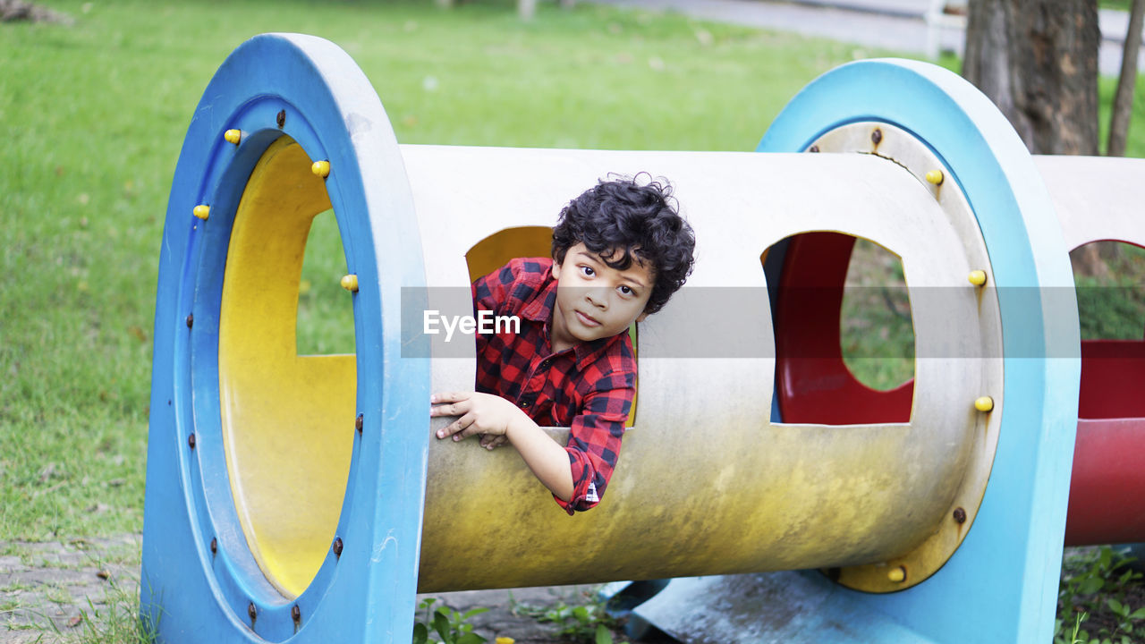 Portrait of smiling boy in playground