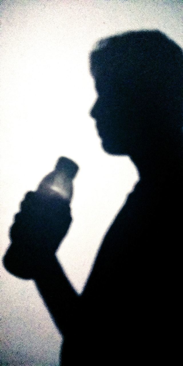 SHADOW OF MAN HOLDING WOMAN ON SILHOUETTE OF PEOPLE