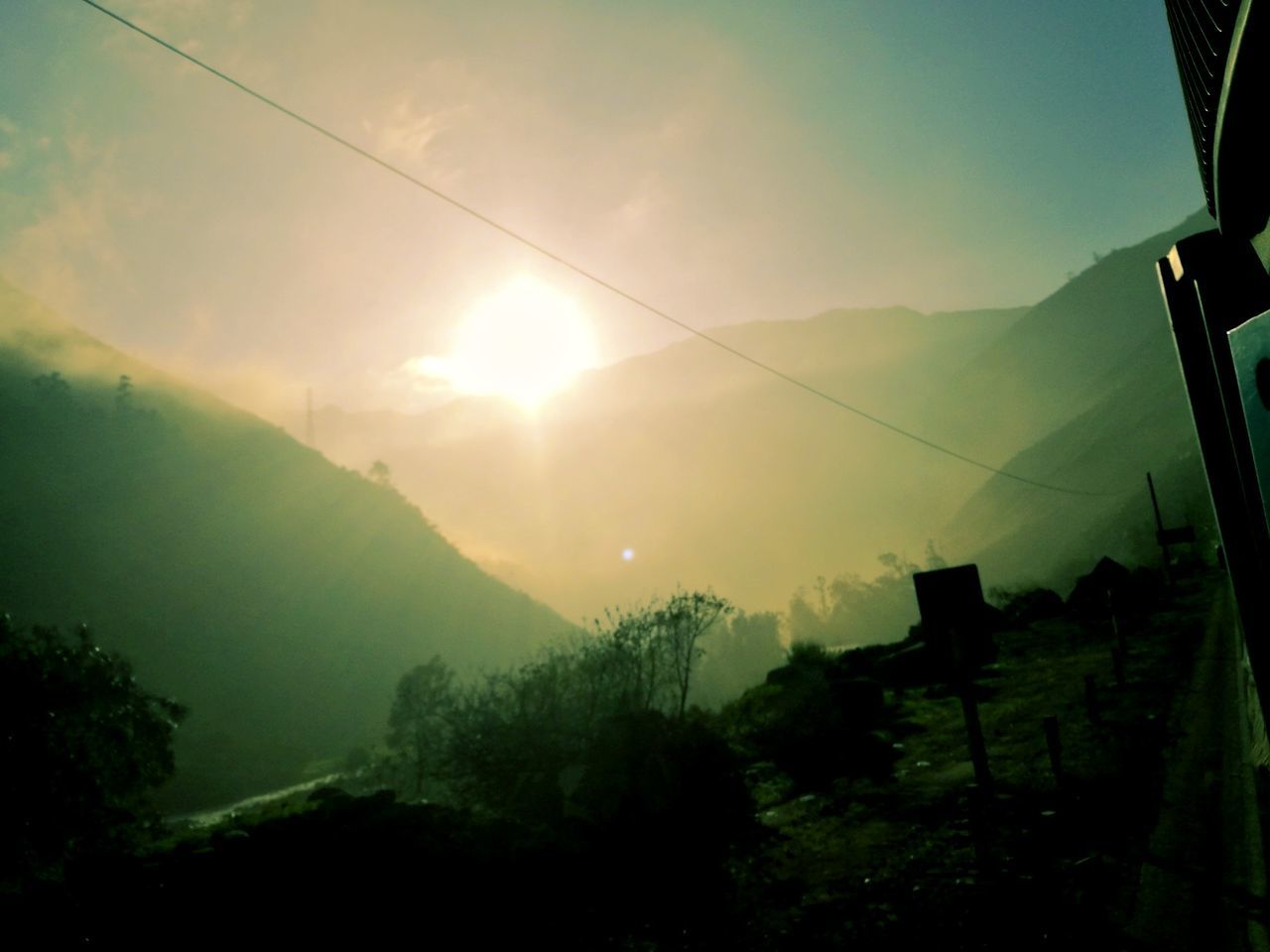 SCENIC VIEW OF TREE MOUNTAINS AGAINST SKY