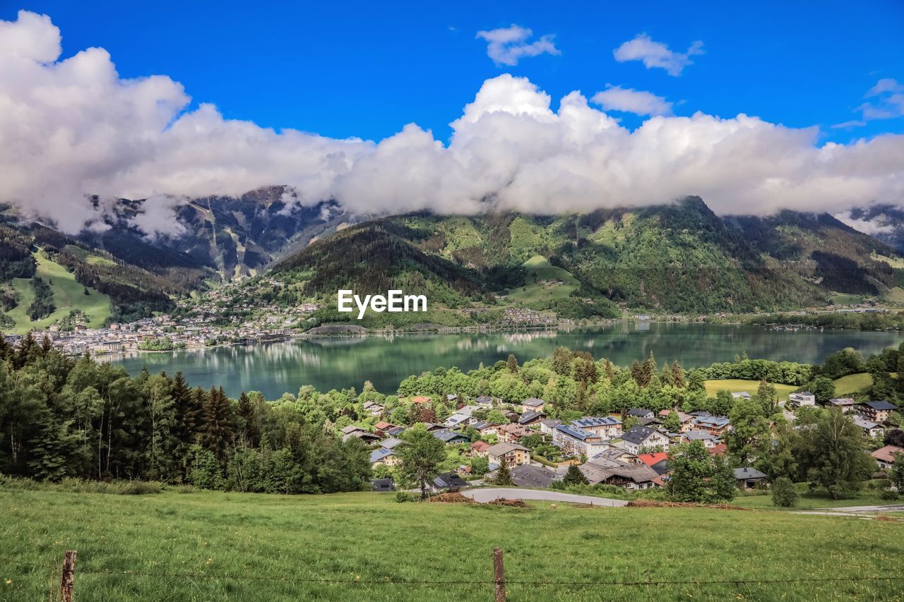 SCENIC VIEW OF LAKE AGAINST MOUNTAIN