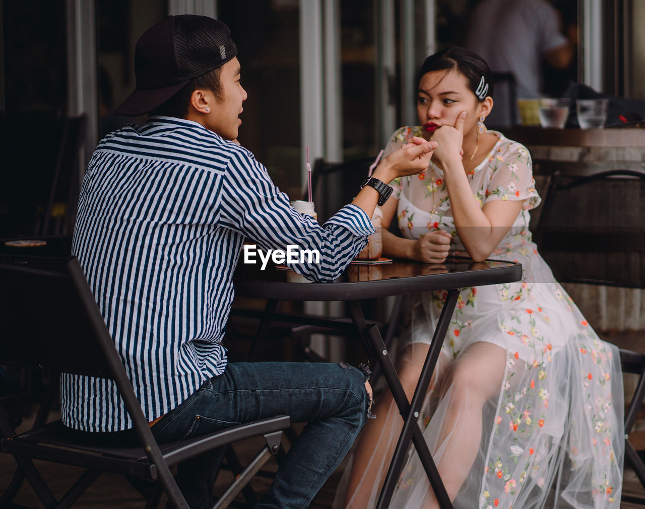 Couple sitting at cafe