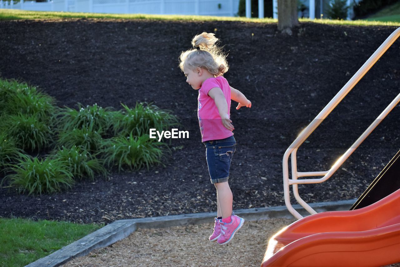 Girl jumping in playground