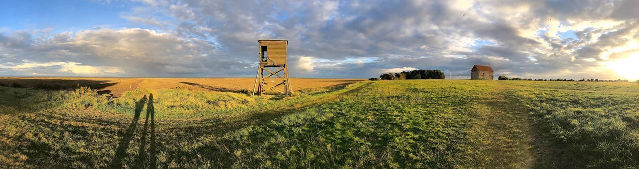 PANORAMIC VIEW OF FARM AGAINST SKY