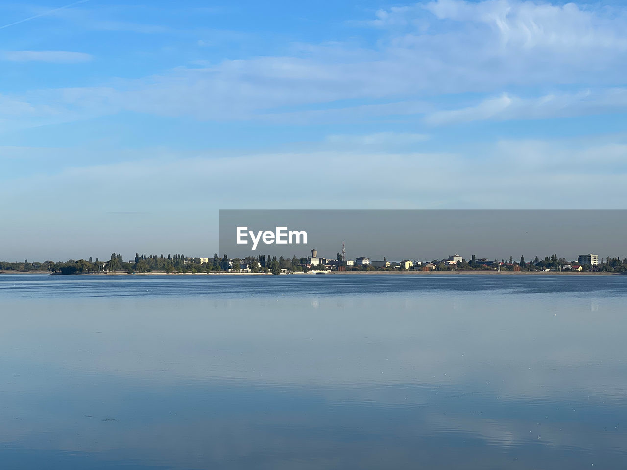 water, reflection, sky, horizon, cloud, nature, sea, waterfront, beauty in nature, no people, tranquility, scenics - nature, shore, architecture, tranquil scene, day, morning, built structure, dusk, building exterior, outdoors, blue, body of water, ocean, coast, city, idyllic, bay