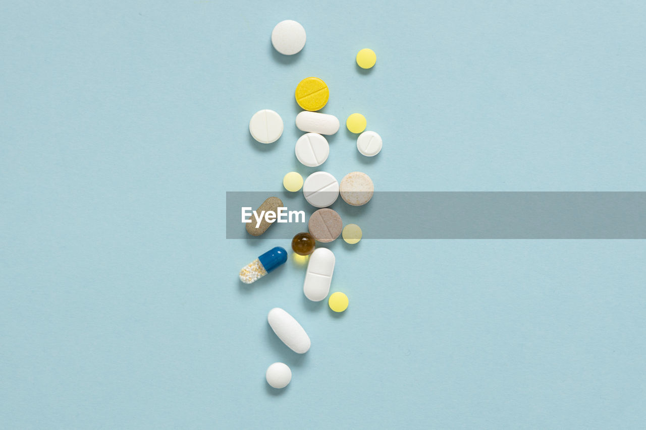Close-up of pills on blue background