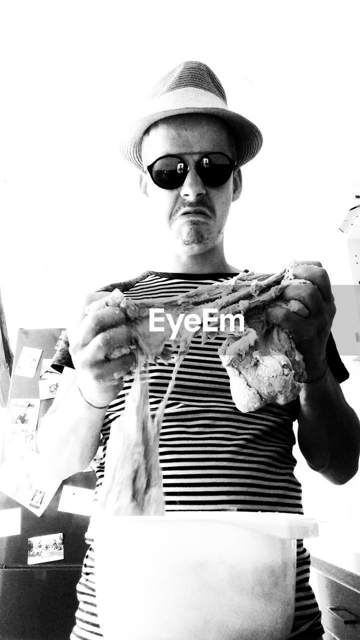 Portrait of man preparing bread