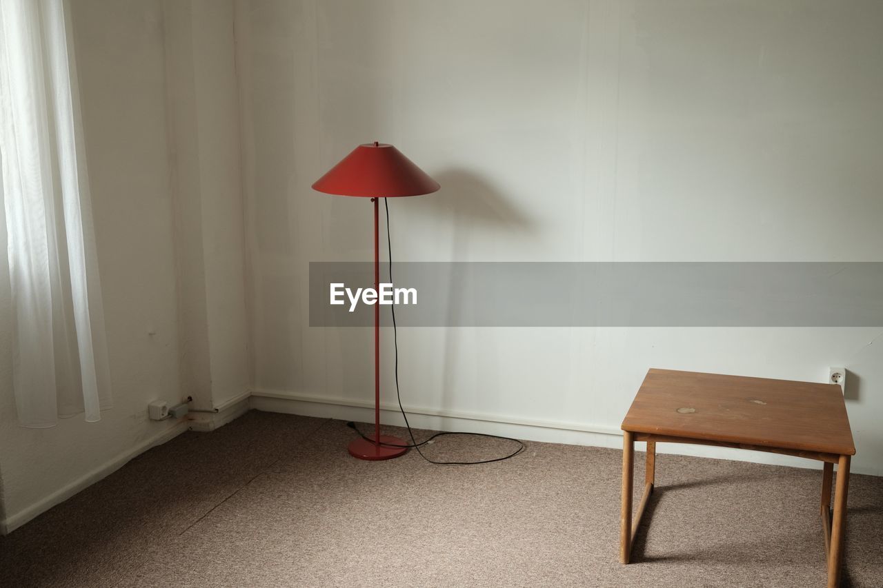 EMPTY CHAIRS AGAINST WALL AT HOME