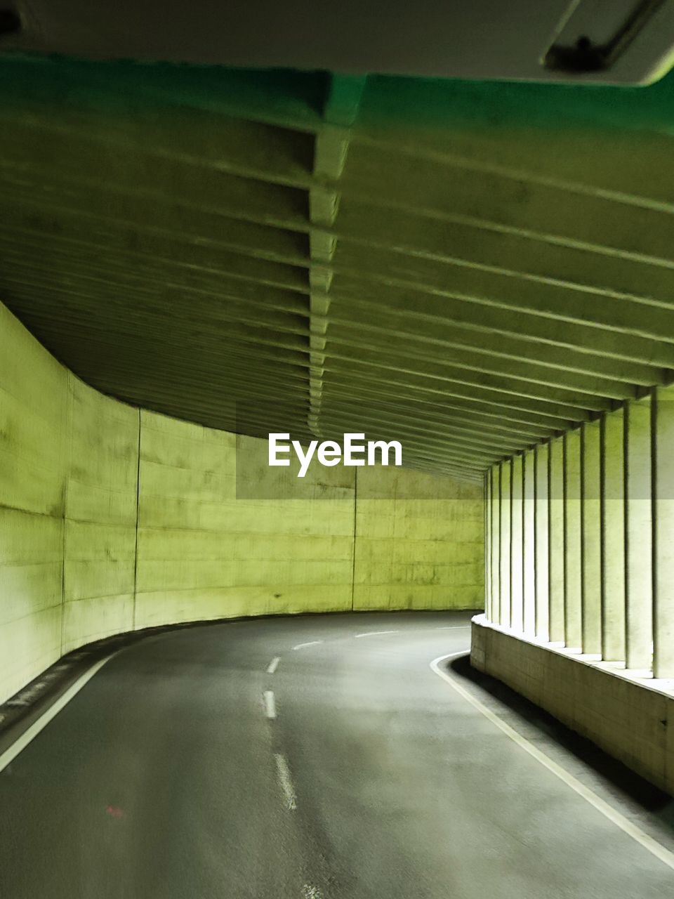 architecture, subway, transportation, indoors, built structure, no people, light, parking garage, empty, green, ceiling, road, tunnel, parking lot, wall - building feature, absence, city, mode of transportation, day, interior design, concrete
