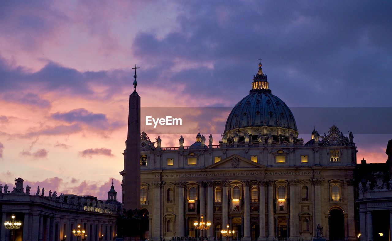 Low angle view of st peter basilica against sky during sunset