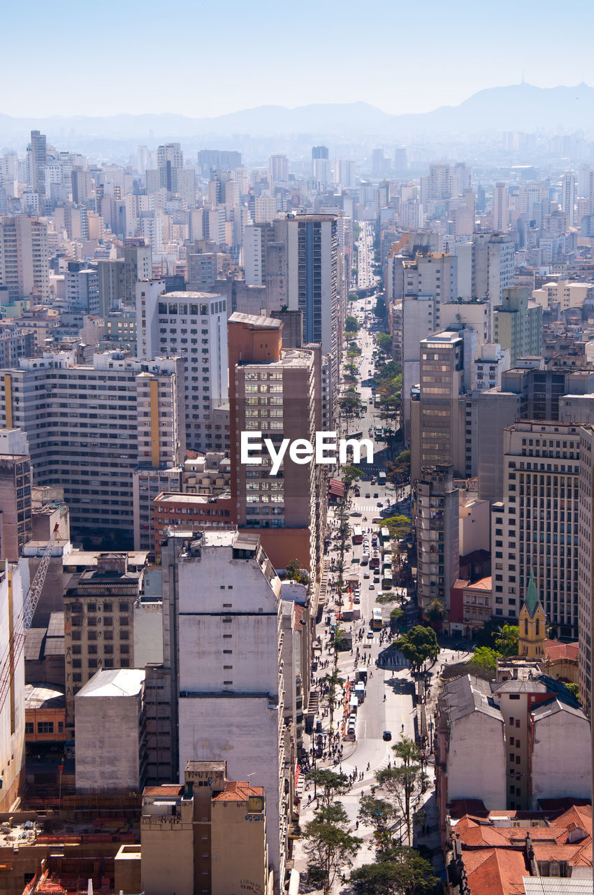 High angle view of buildings in city against sky