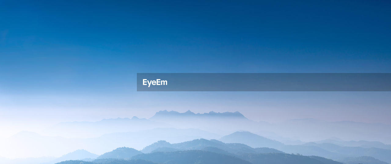 Scenic view of mountains against clear blue sky. doi luang chiang dao.