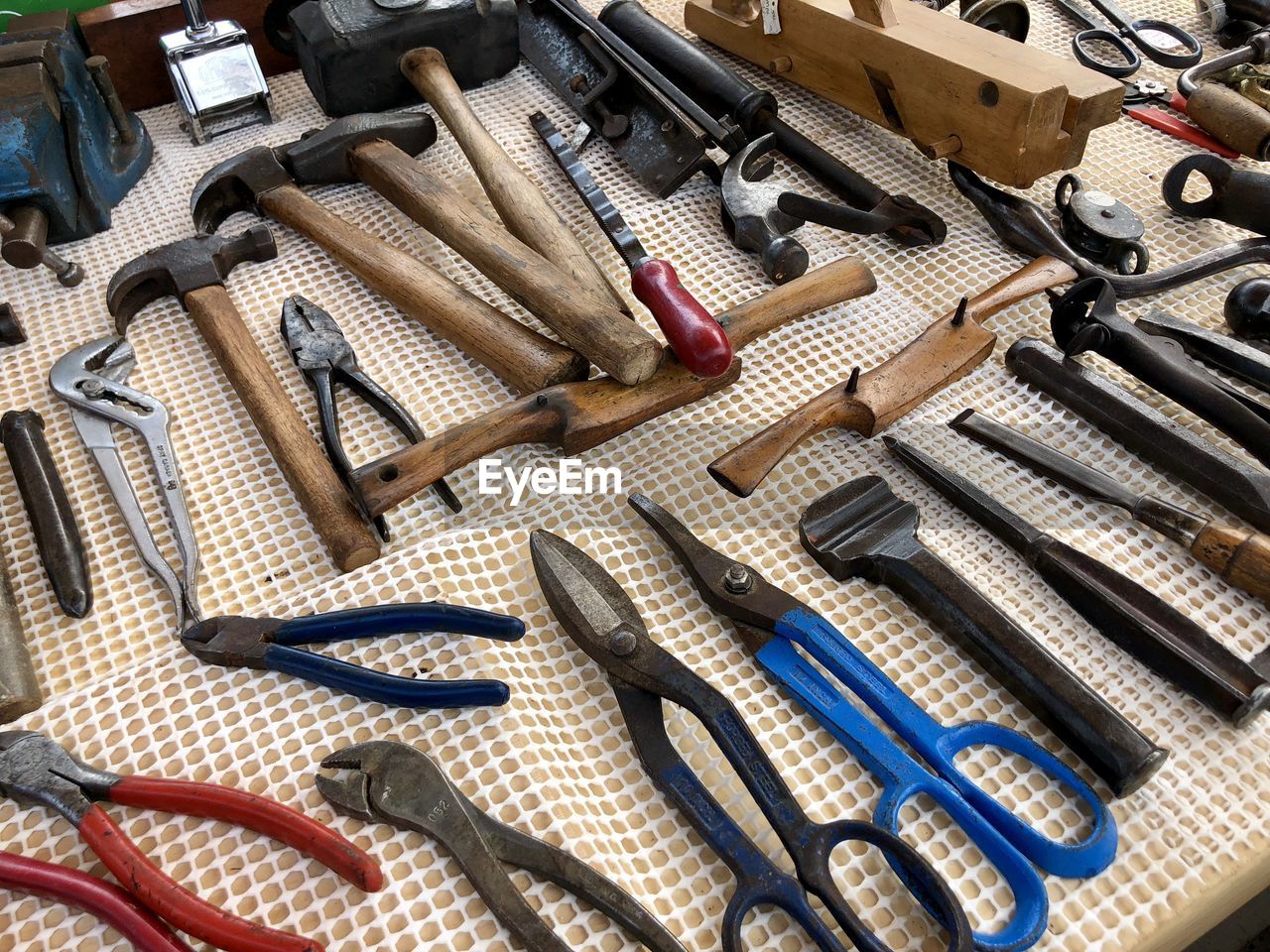 High angle view of tools on table in workshop