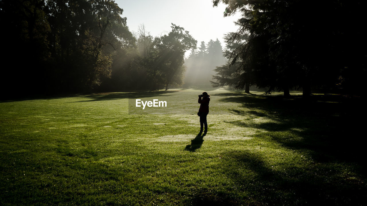 Woman standing on field