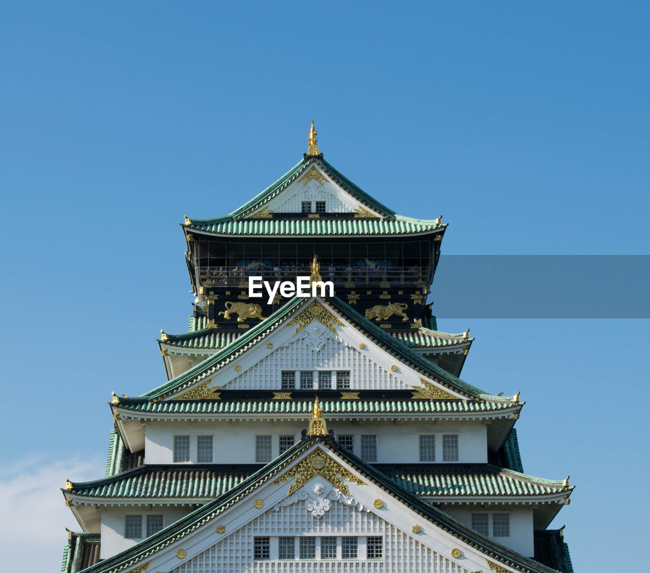 Low angle view of temple against blue sky