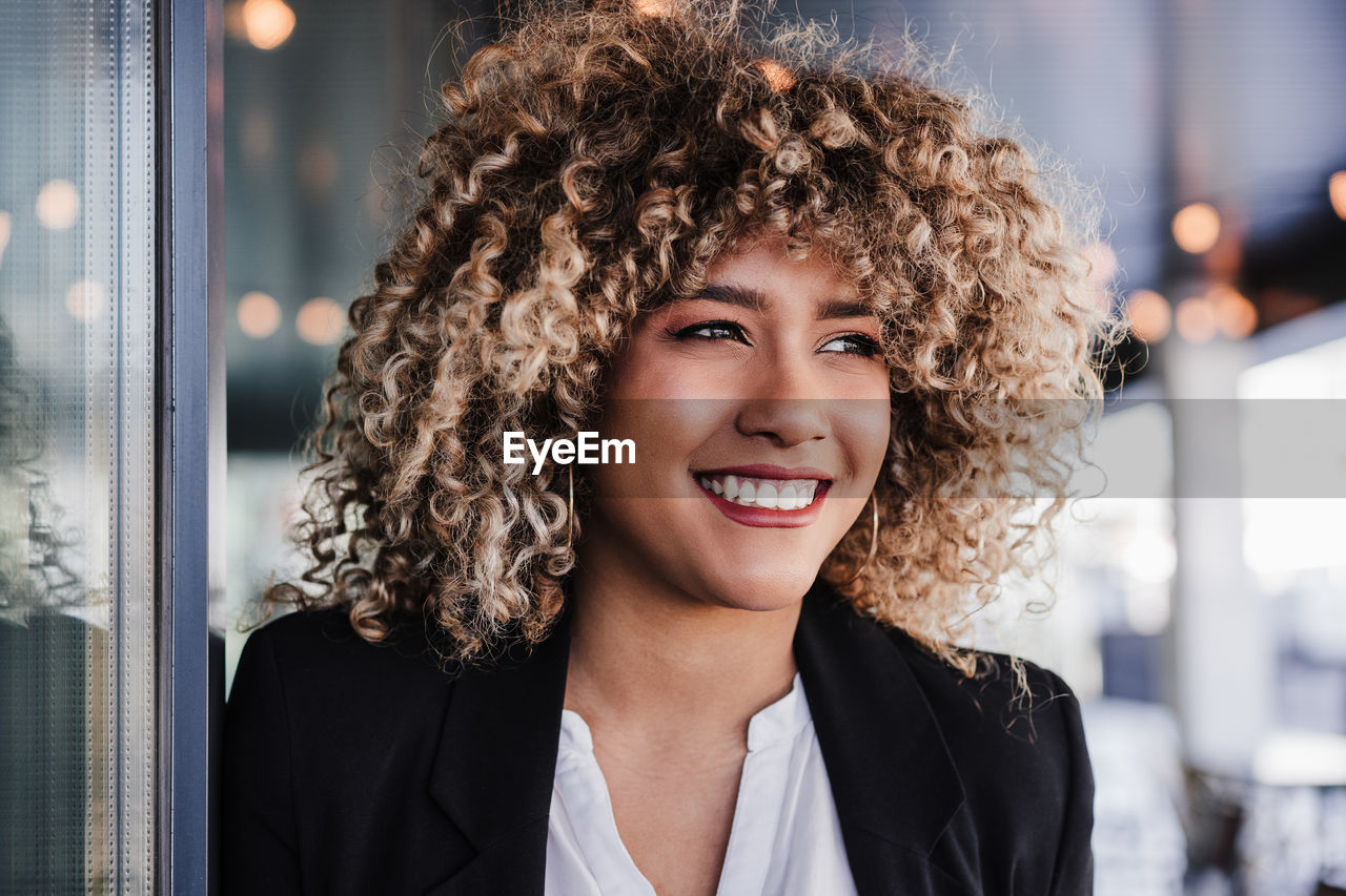 Portrait of happy confident business woman in cafe. business concept