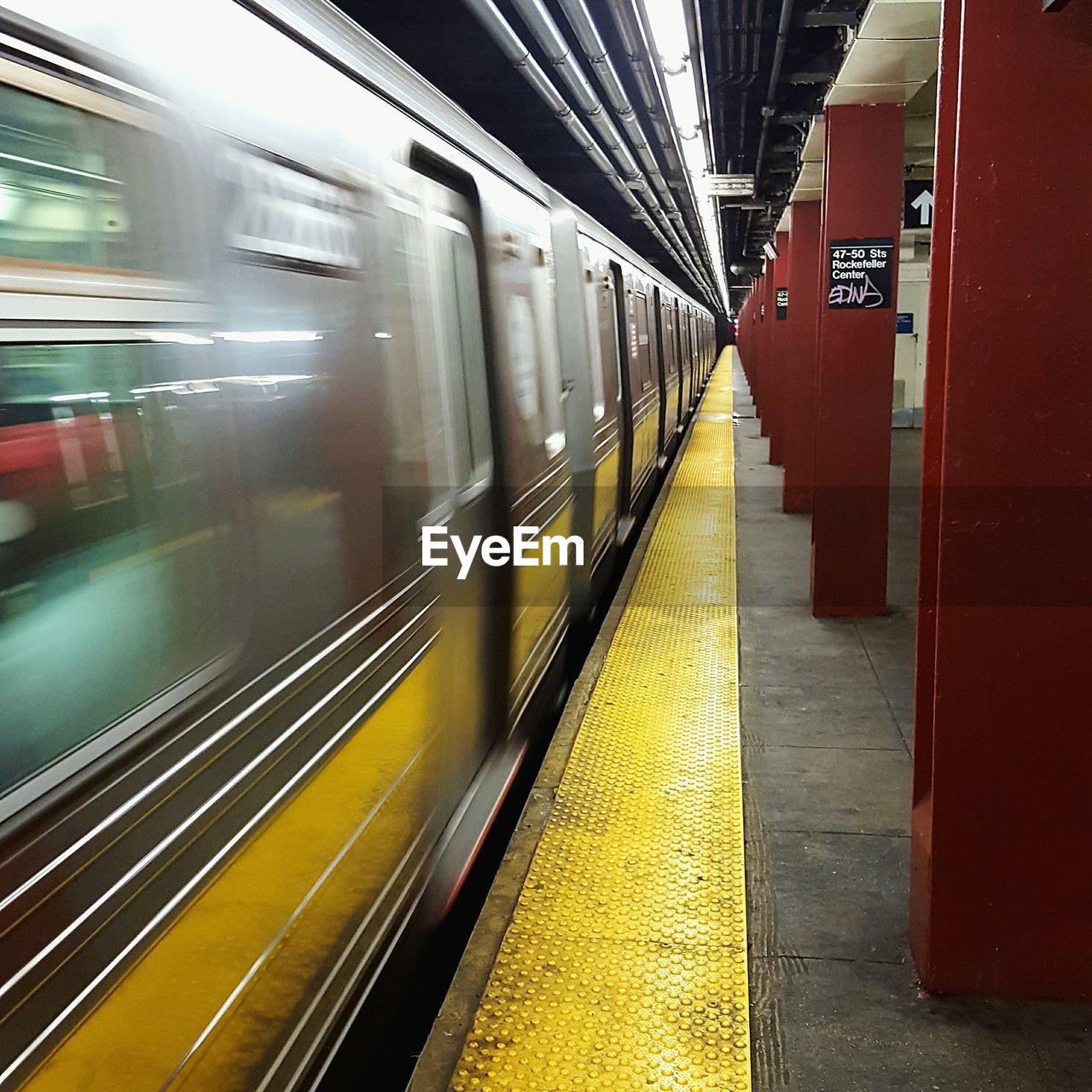 Blurred motion of train at subway station