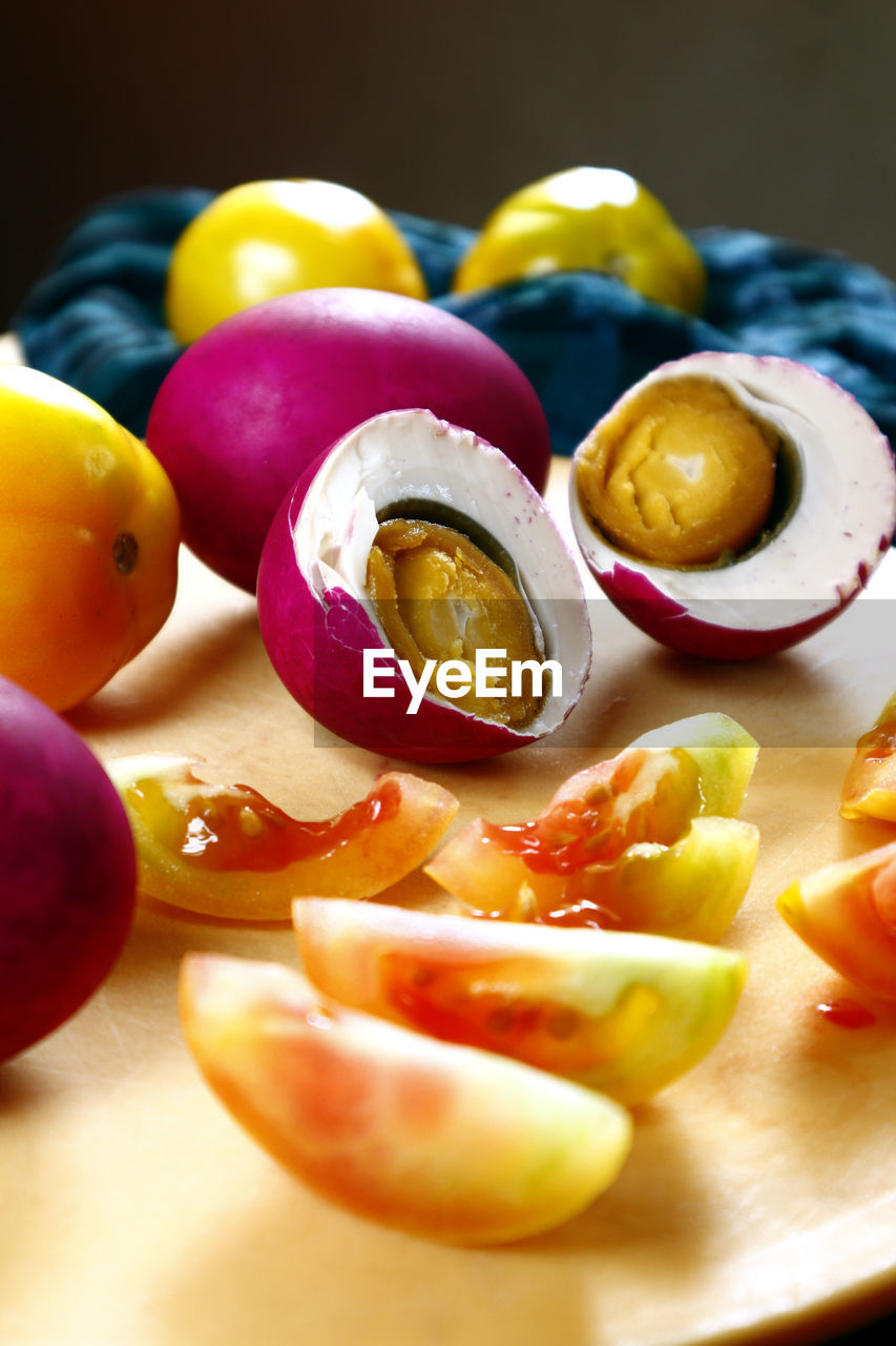 Close-up of fruit and vegetable on cutting board