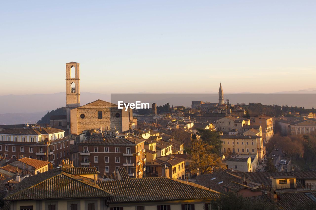 High angle view of buildings in city against clear sky