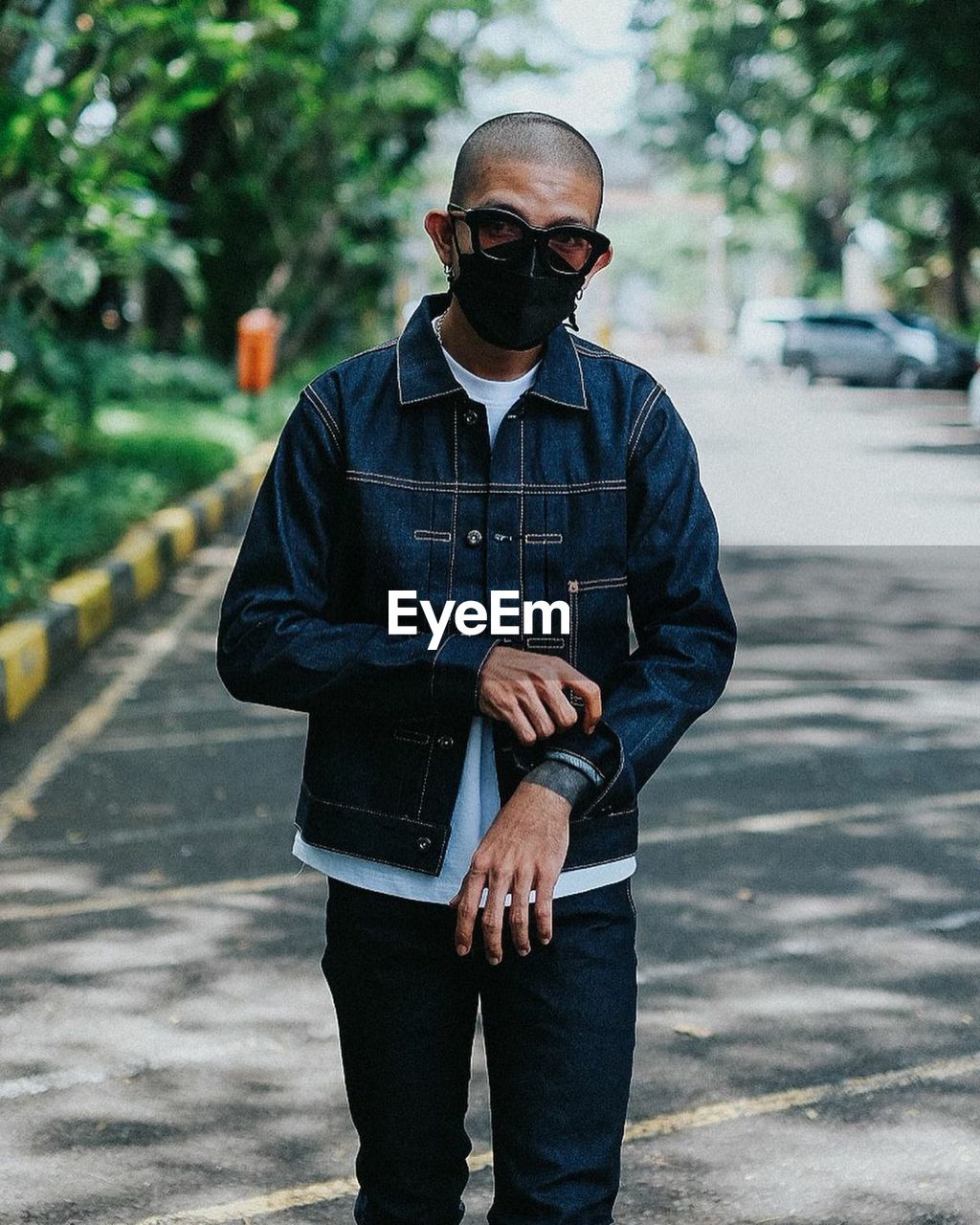 Portrait of man wearing sunglasses standing on street