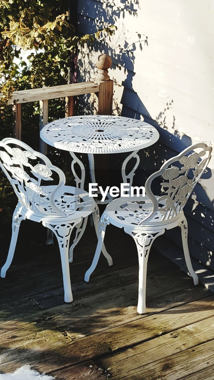 CHAIRS AND TABLE IN WINTER