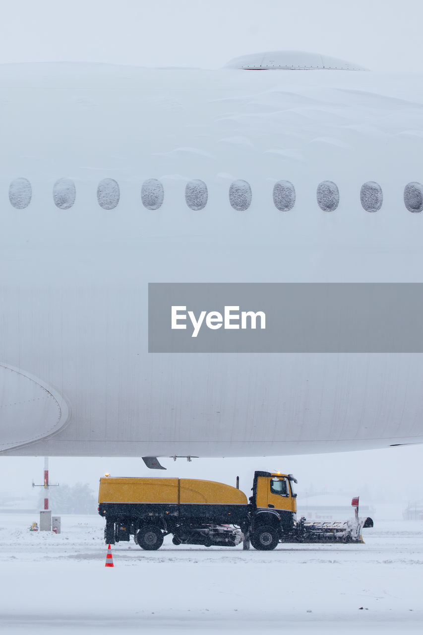 Winter frosty day at airport during heavy snowfall. 