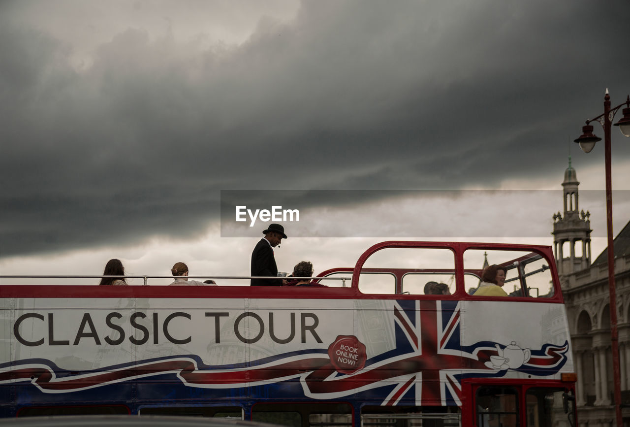 LOW ANGLE VIEW OF AMUSEMENT PARK AGAINST SKY