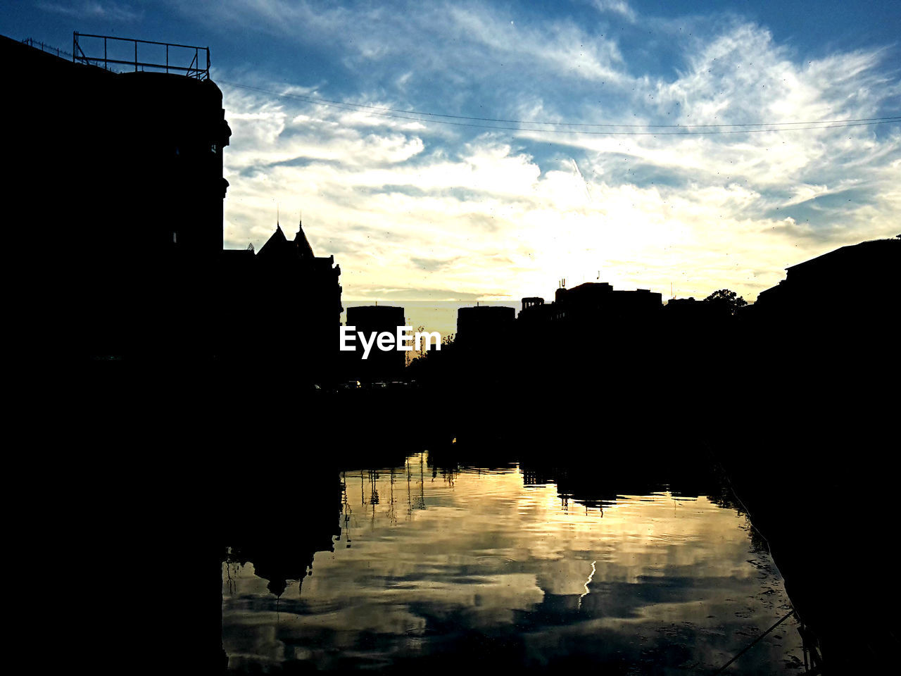 SILHOUETTE OF BUILDINGS AT SUNSET