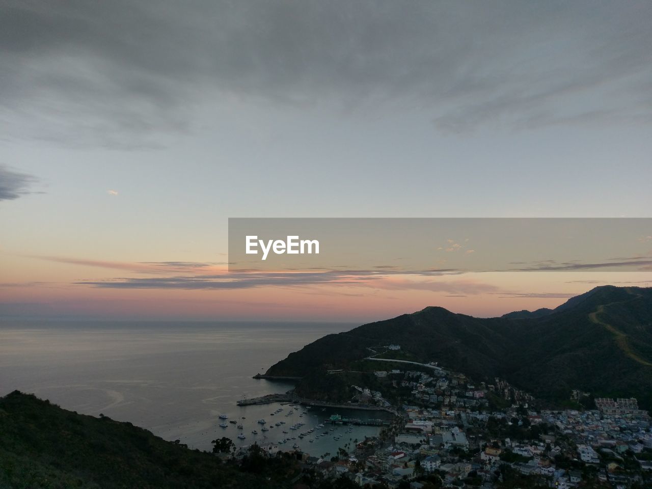 SCENIC VIEW OF SEA AGAINST ORANGE SKY