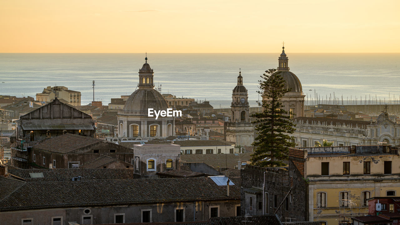 Cupola of saint agatha cathedral at sunrise, aerial view, in catania city, sicily, italy