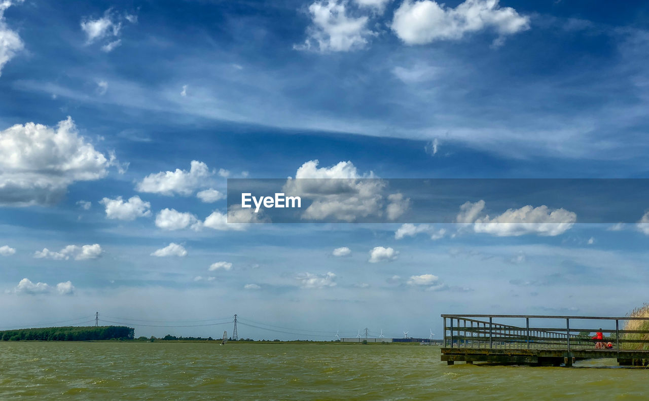 Bridge over sea against sky