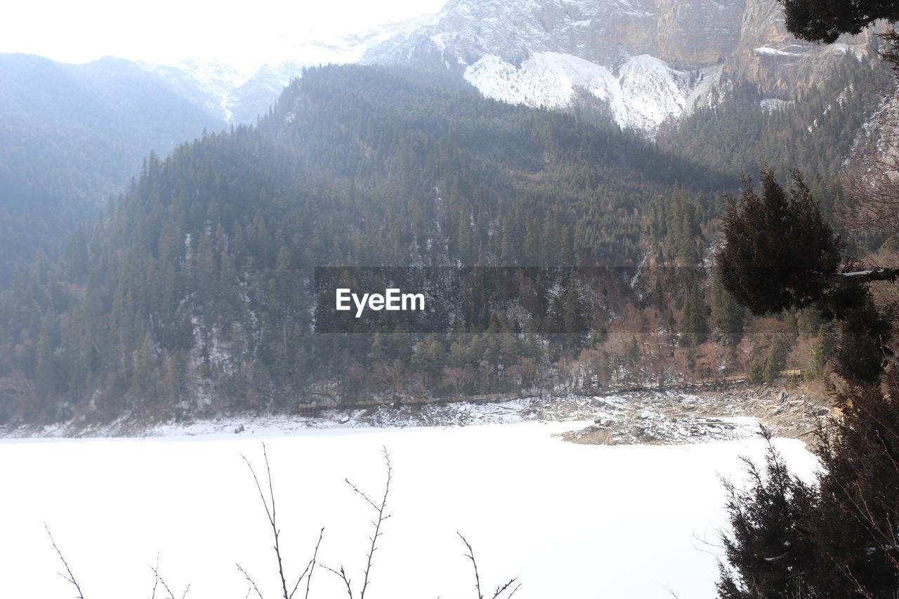 SCENIC VIEW OF LAKE AND SNOWCAPPED MOUNTAINS