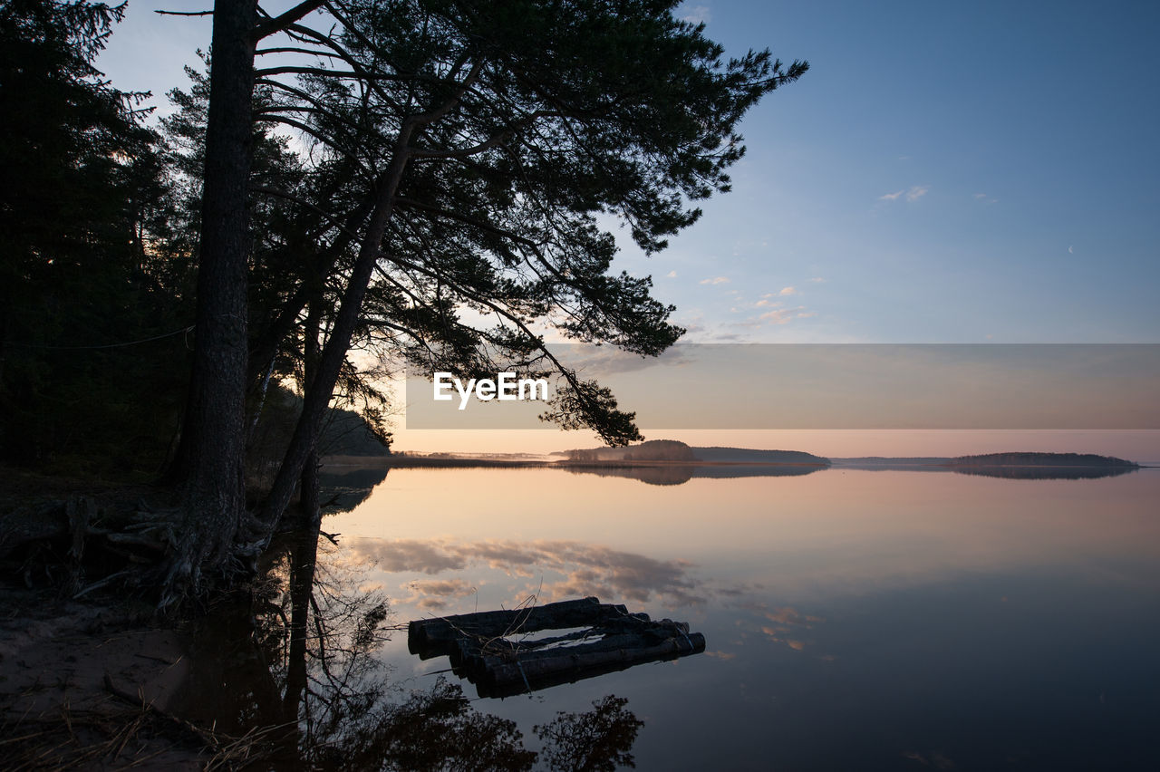 Scenic view of lake against sky during sunset