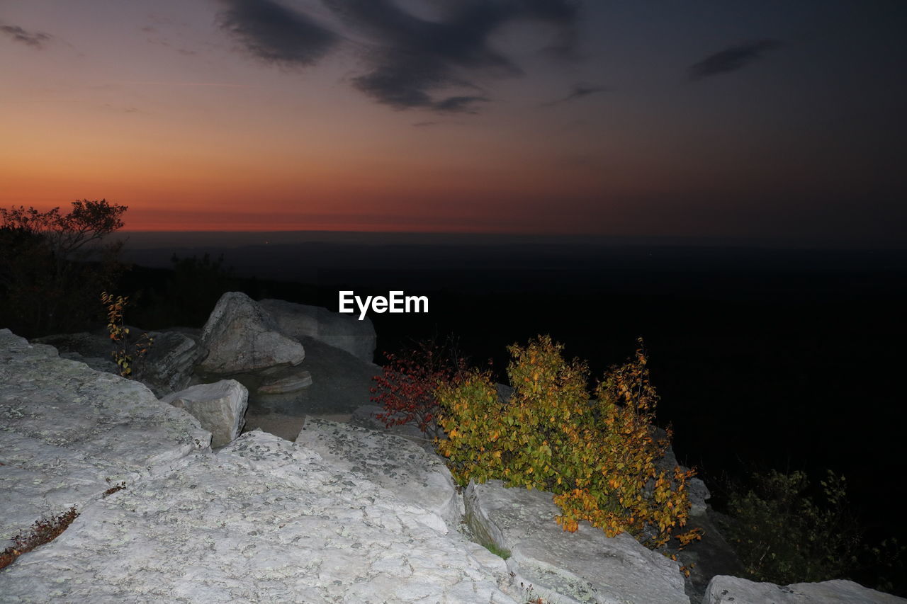 Scenic view of sea against sky at sunset