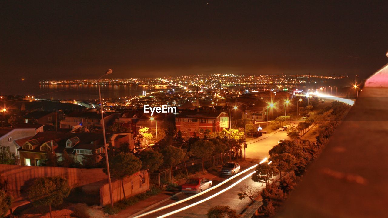 ILLUMINATED CITYSCAPE AT NIGHT