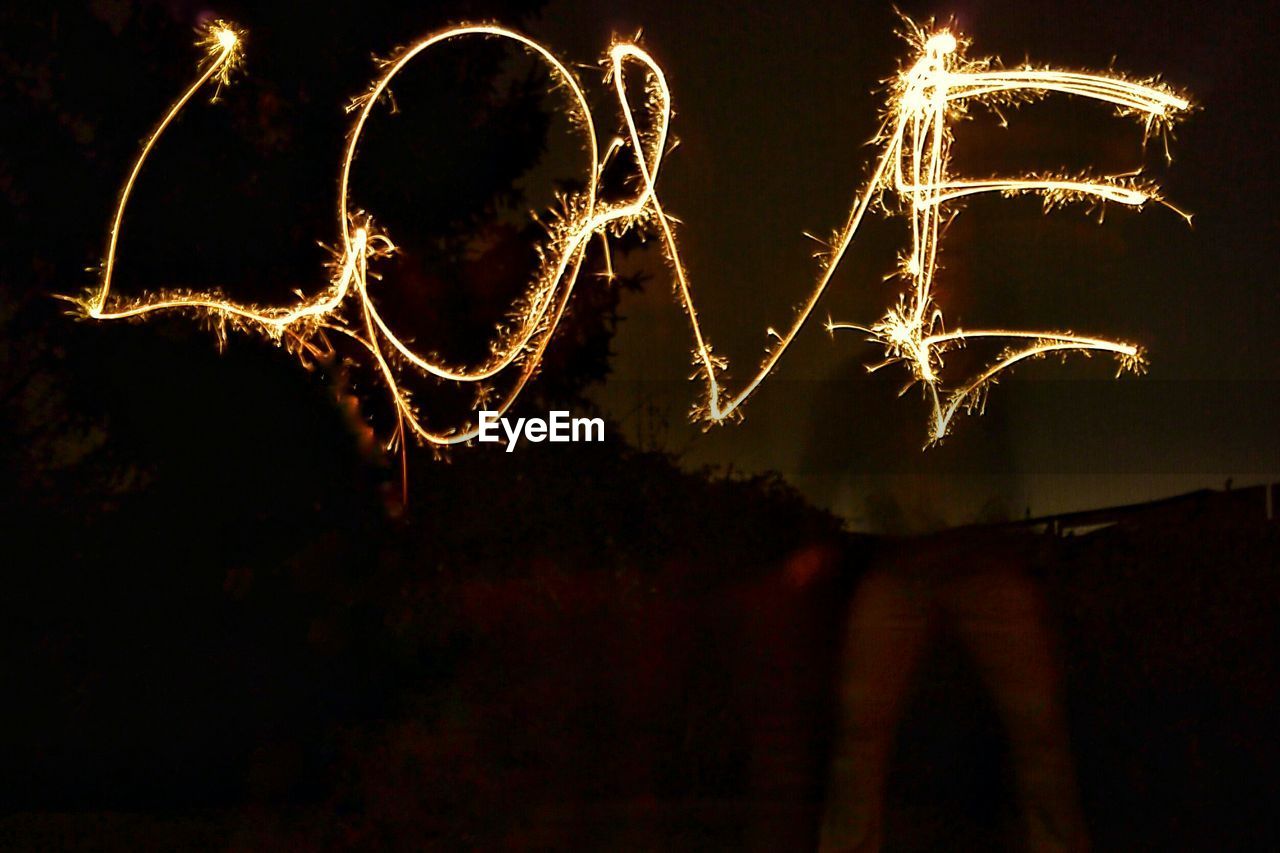 Close-up of text written by light painting at night