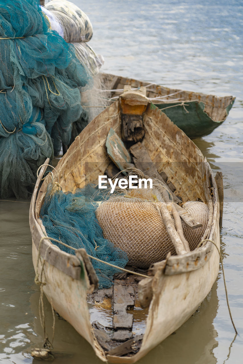 High angle view of fishing net and boat in sea