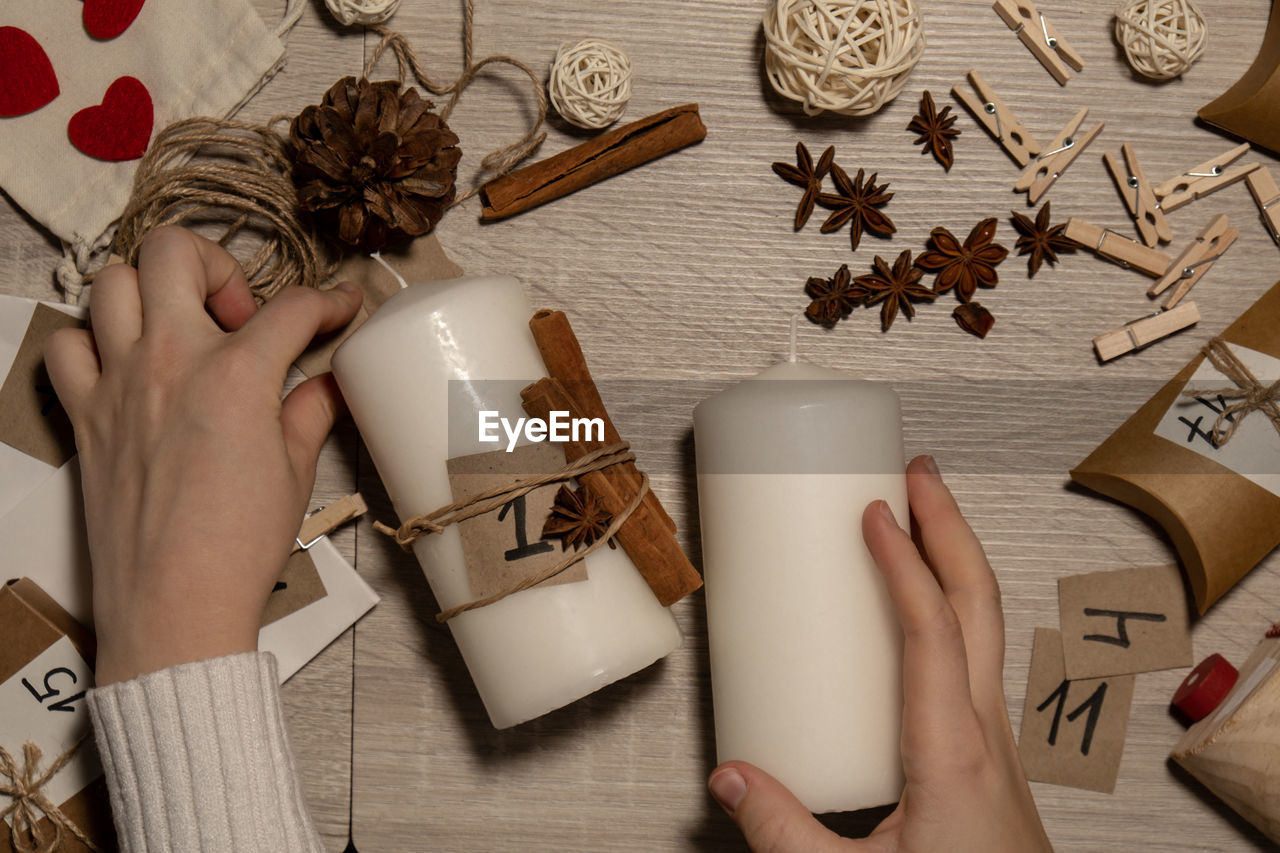 cropped hand of woman holding christmas decoration