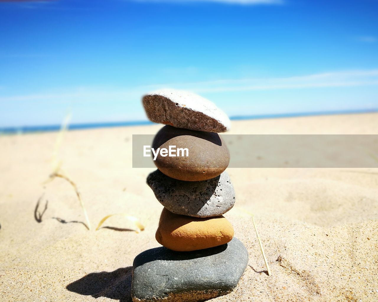 STACK OF PEBBLES ON BEACH