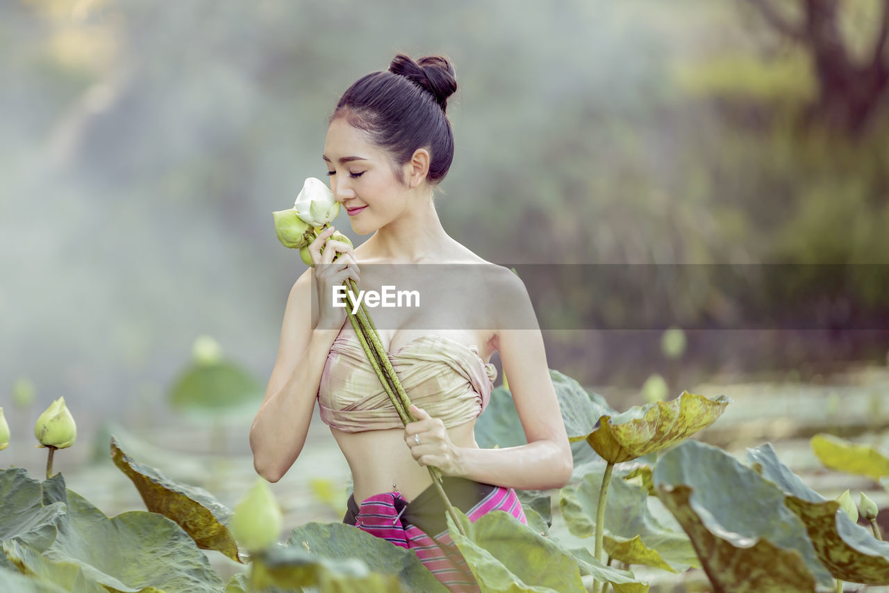 Young woman with buds